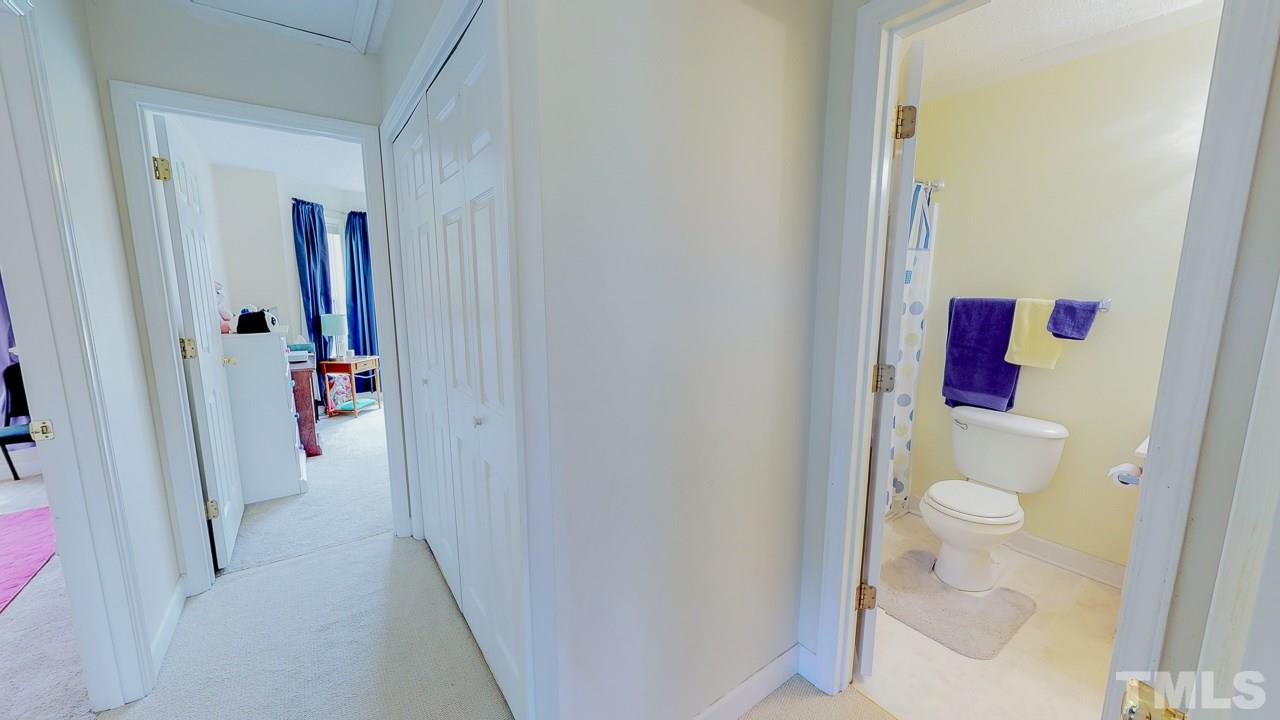 1130 Willie Gray Road Timberlake, NC 27583 - Photo 23 of 27 a hallway with kids room bathroom