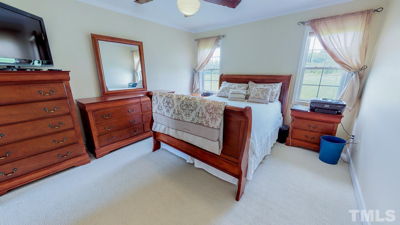 1130 Willie Gray Road Timberlake, NC 27583 - Photo 10 of 27 a bed room with a bed and a dresser