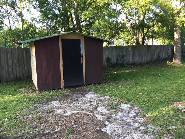 a backyard of a house with lots of green space