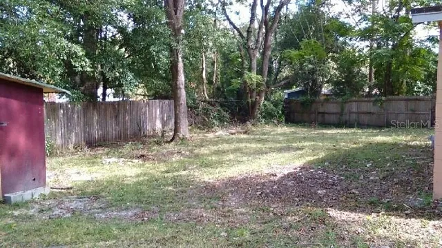 a view of backyard with tree