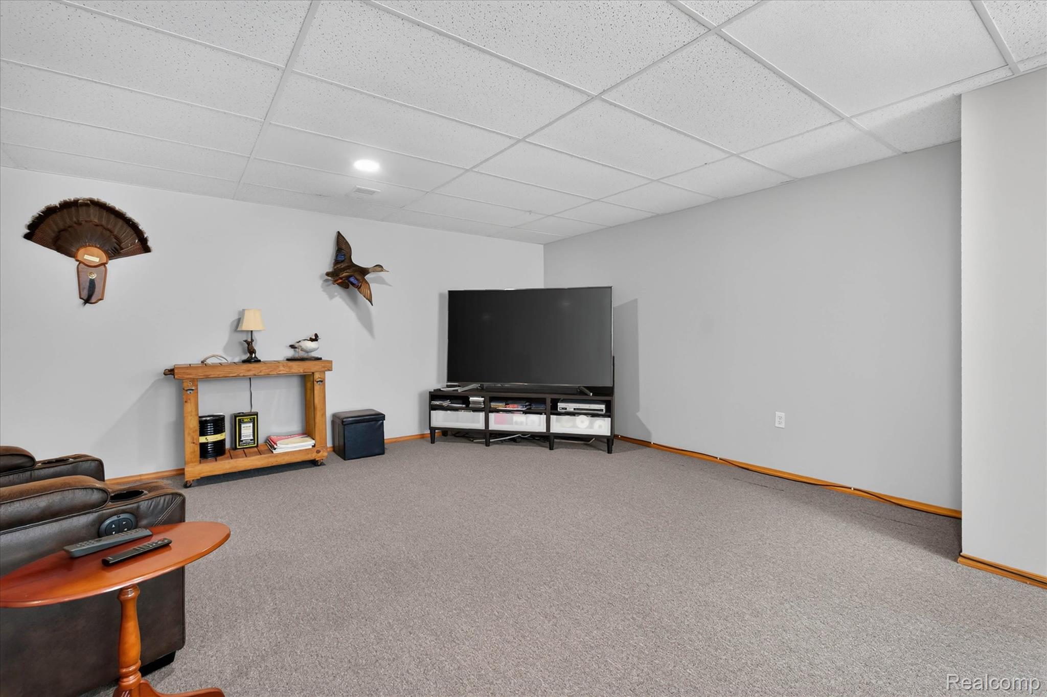 4037 Chilson Road Howell, MI 48843 - Photo 35 of 69 Recessed lighting, light gray walls, wood trim, and textured ceiling panels