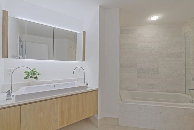 a bathroom with a sink and a bathtub