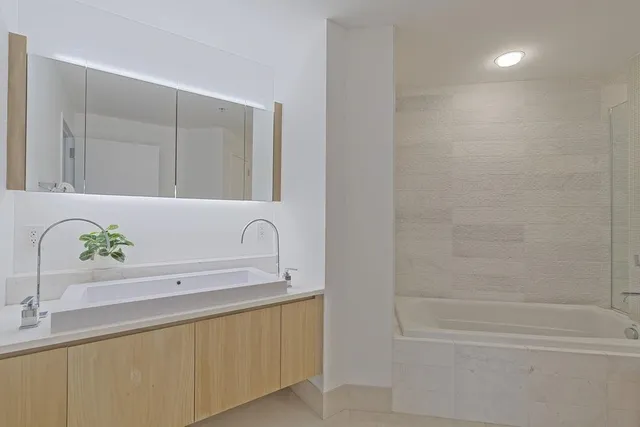 a bathroom with a sink and a bathtub