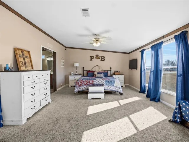a living room with furniture ceiling fan