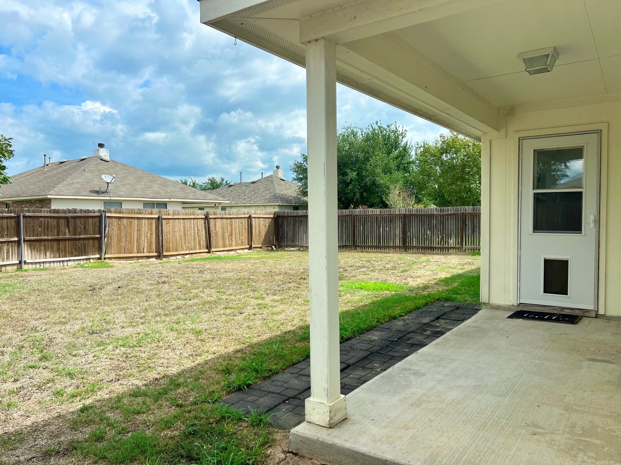 107 Thompson Trail Bastrop, TX 78602 - Photo 17 of 23 Covered back patio with pet door !