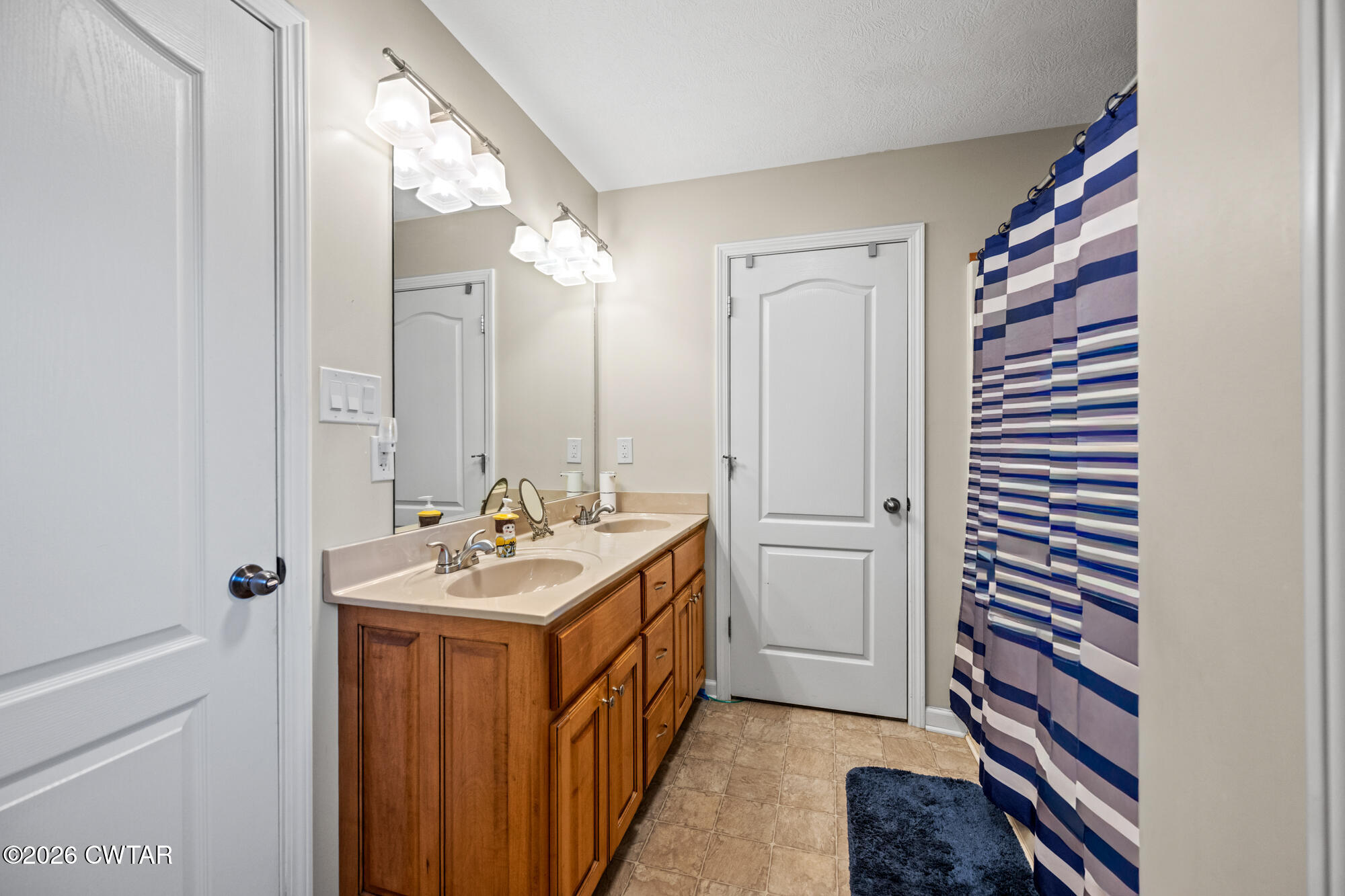492 Joe Horton Road Lexington, TN 38351 - Photo 20 of 49 a bathroom with a sink and a mirror