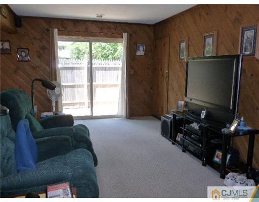 2 MacAfee Road Somerset, NJ 08873 - Photo 14 of 25 a living room with furniture and a flat screen tv