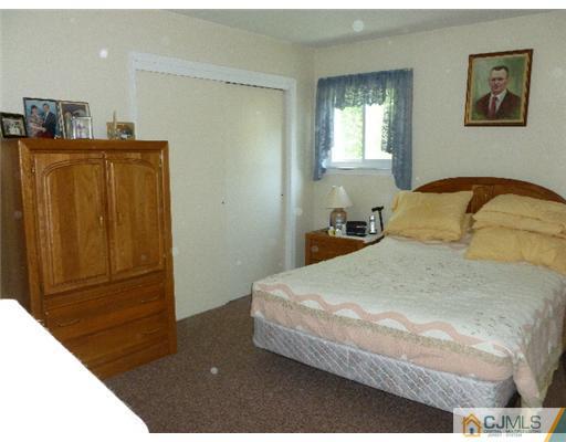 2 MacAfee Road Somerset, NJ 08873 - Photo 22 of 25 a bedroom with a bed and a window