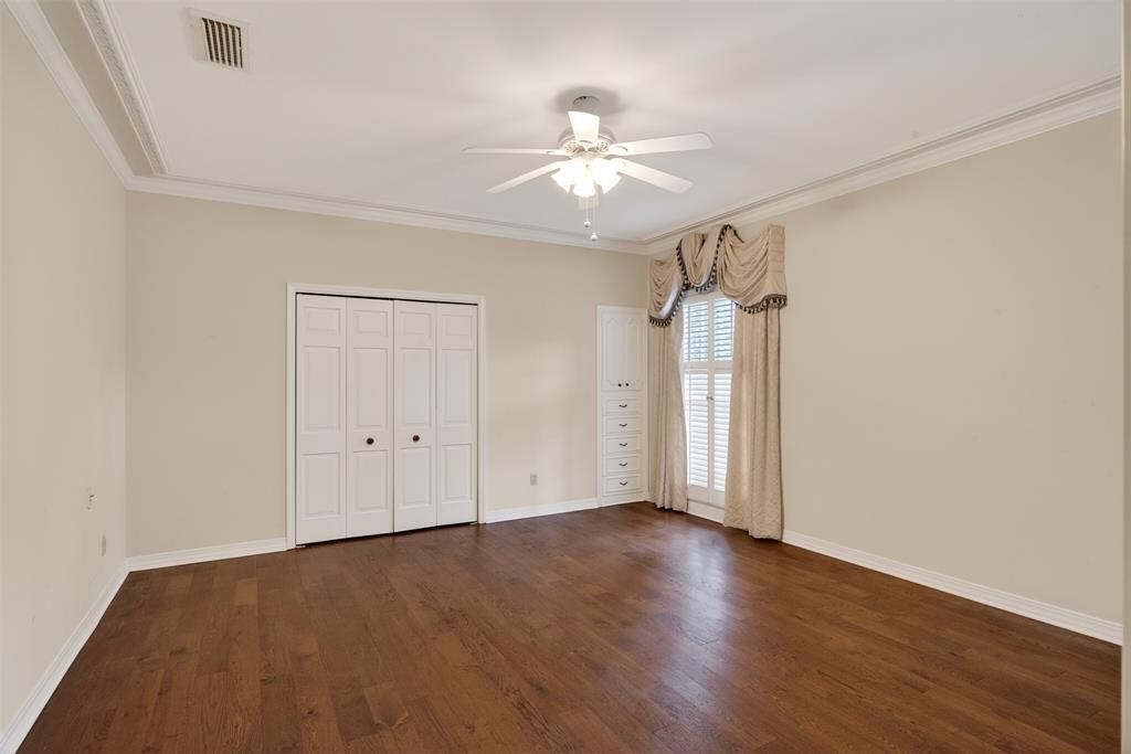 522 Rives Place Shreveport, LA 71106 - Photo 16 of 40 an empty room with wooden floor fan and windows