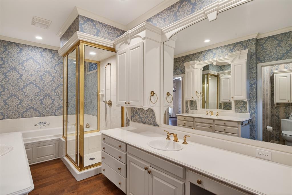 522 Rives Place Shreveport, LA 71106 - Photo 22 of 40 a spacious bathroom with a double vanity sink a large mirror and shower