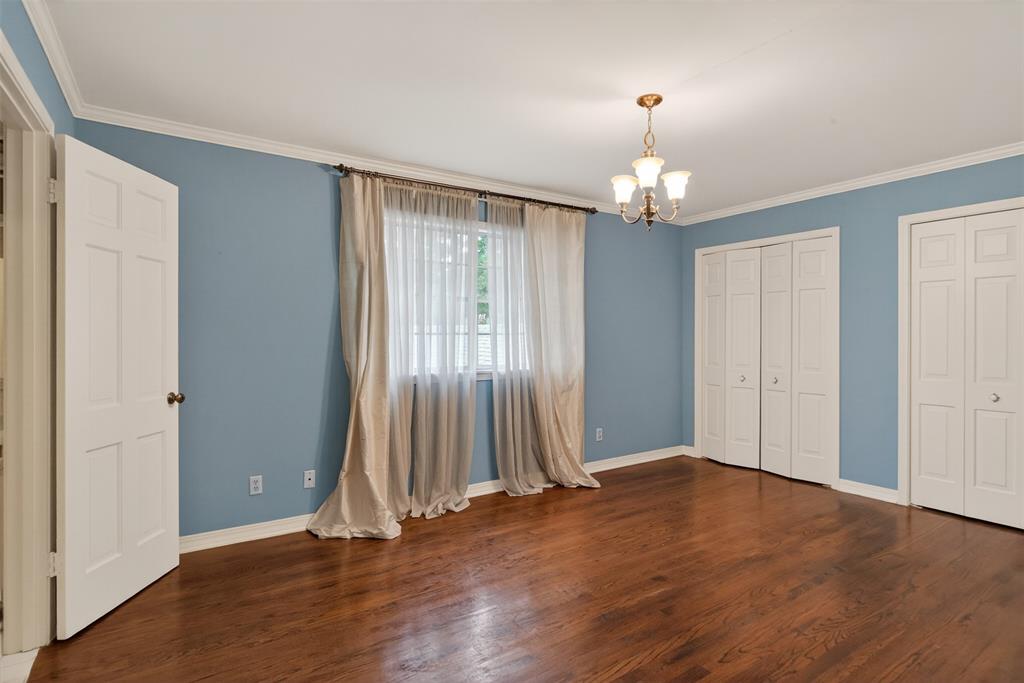 522 Rives Place Shreveport, LA 71106 - Photo 28 of 40 an empty room with wooden floor windows and entrance