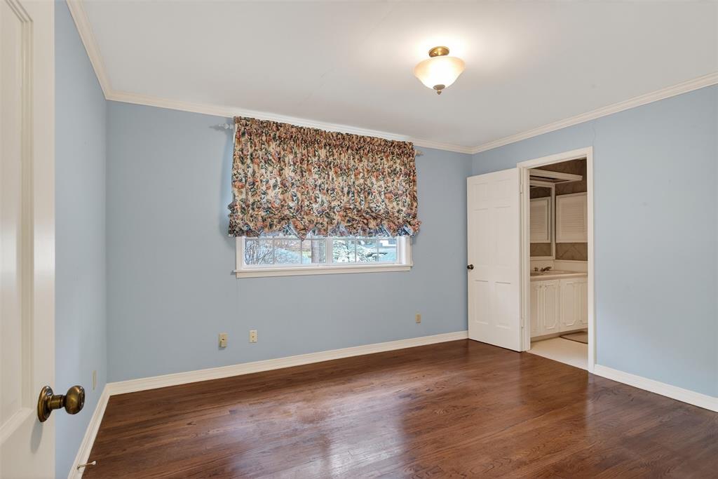 522 Rives Place Shreveport, LA 71106 - Photo 30 of 40 a view of an empty room with a window and wooden floor