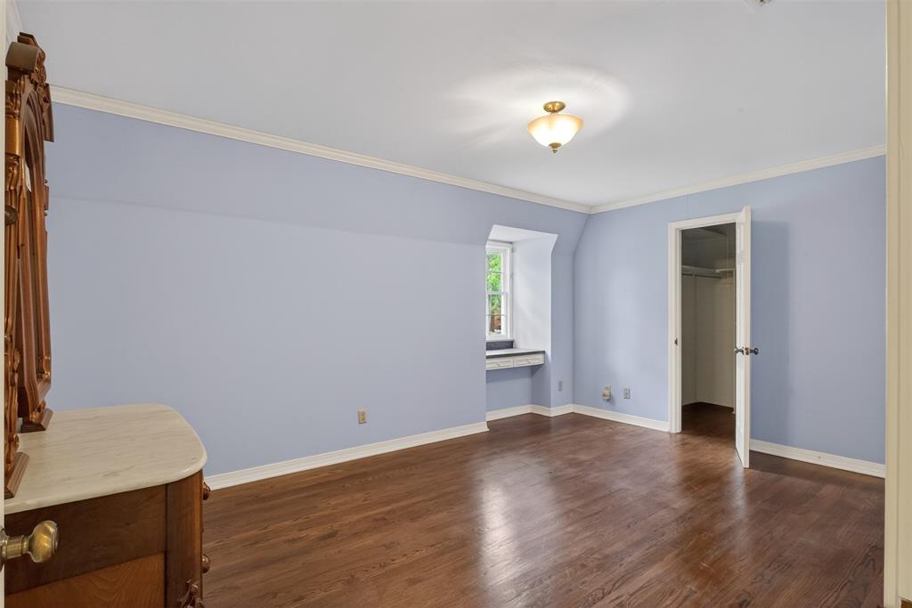 522 Rives Place Shreveport, LA 71106 - Photo 32 of 40 a view of an empty room with a window and wooden floor