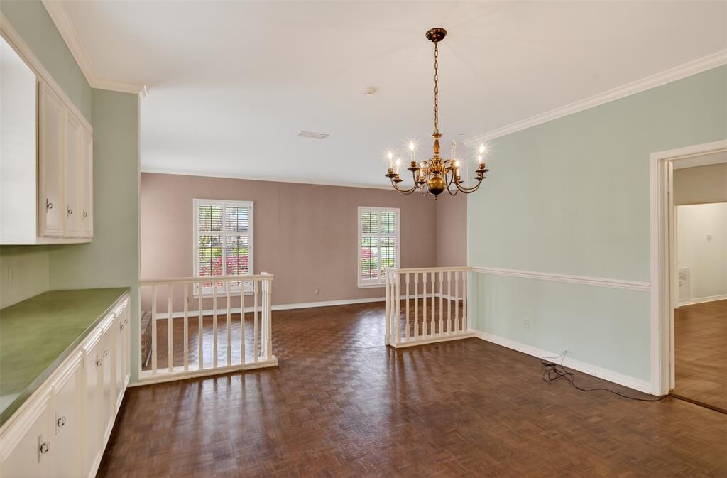 522 Rives Place Shreveport, LA 71106 - Photo 6 of 40 a view of a room with wooden floor staircase and a kitchen