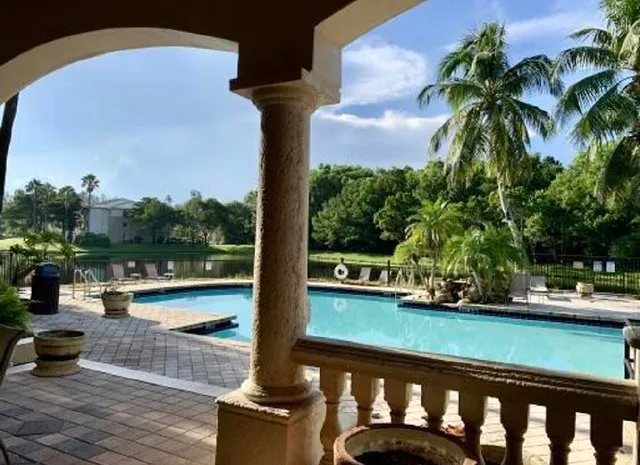 a view of swimming pool with a patio
