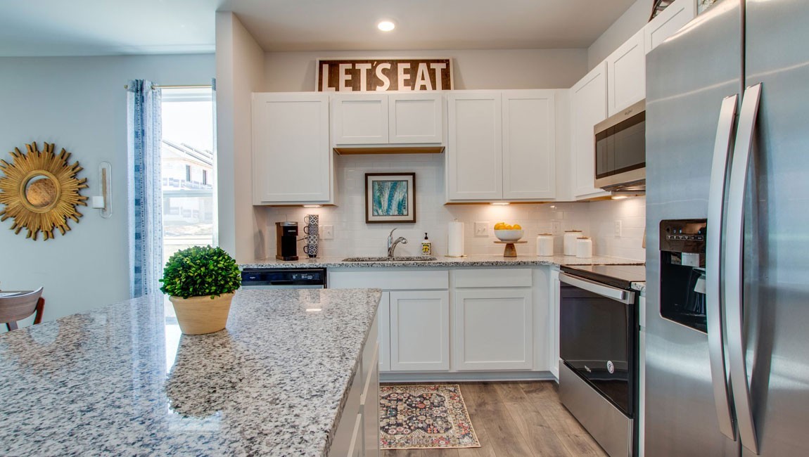 107 Grayson Circle Union City, TN 38261 - Photo 3 of 25 a kitchen with a refrigerator and a sink