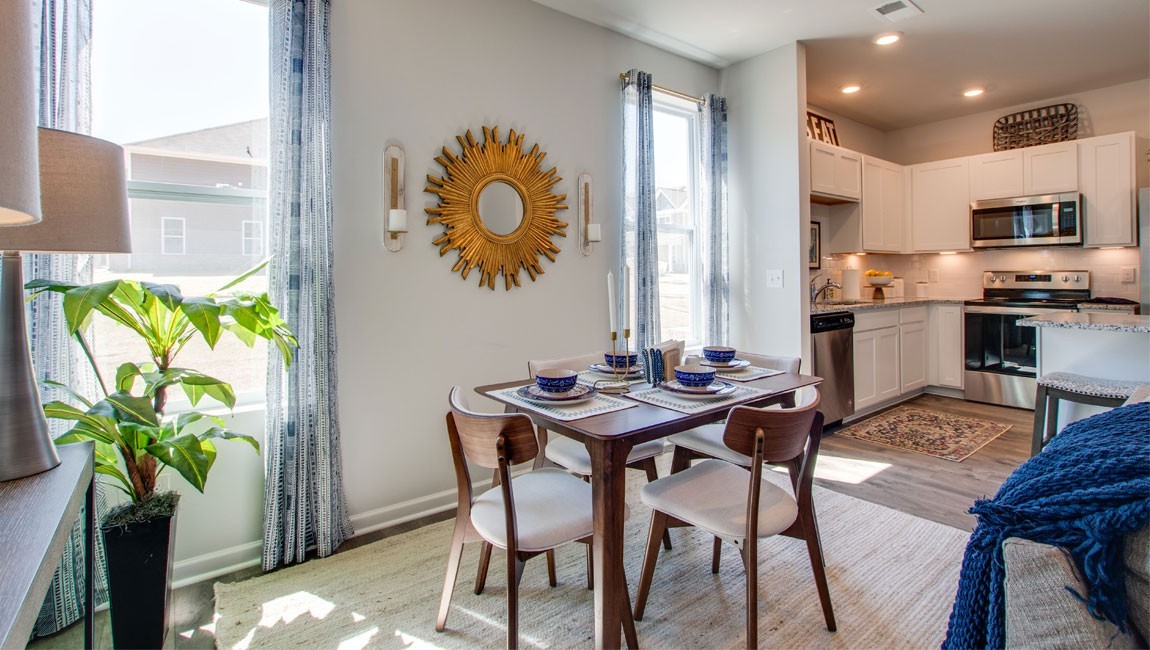 107 Grayson Circle Union City, TN 38261 - Photo 8 of 25 a view of a dining room with furniture a potted plant and wooden floor