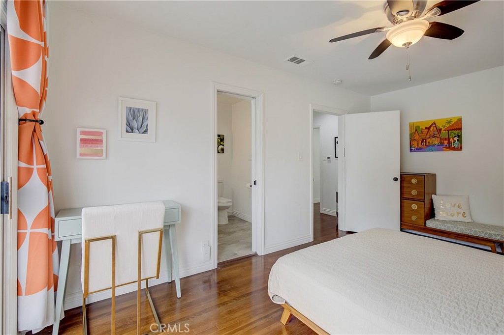 3743 North Studebaker Road Long Beach, CA 90808 - Photo 19 of 32 a bedroom with a bed and wooden floor