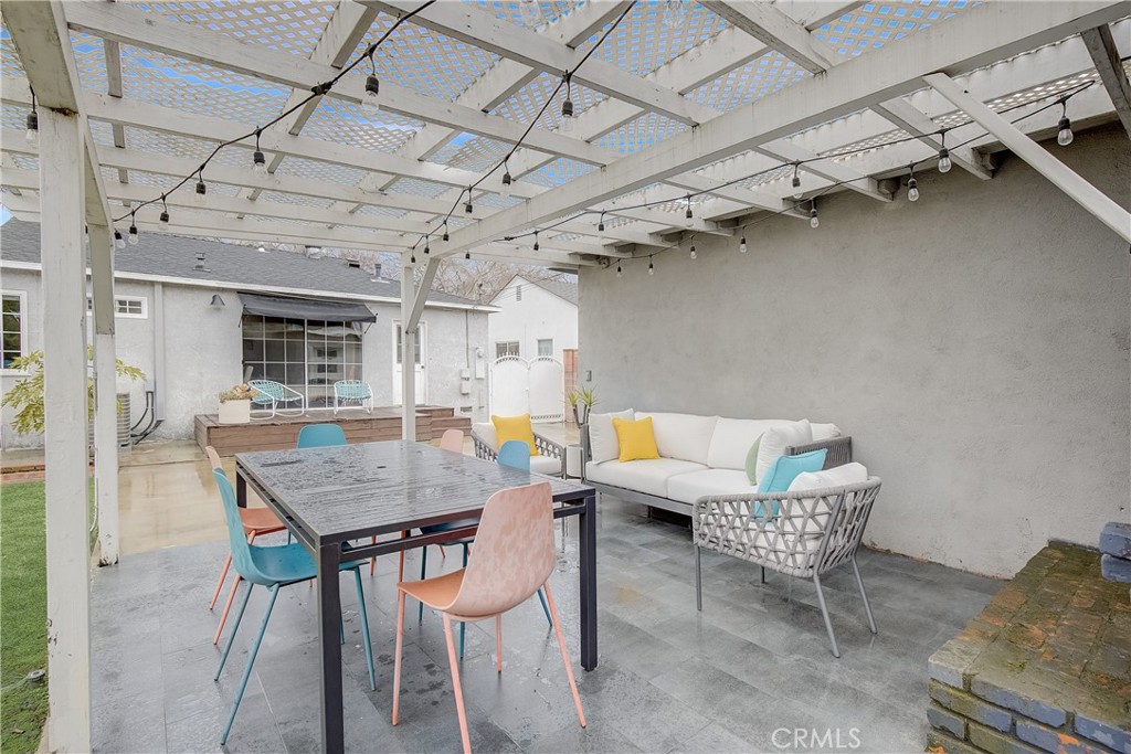 3743 North Studebaker Road Long Beach, CA 90808 - Photo 24 of 32 a dining room with a wooden table and chairs
