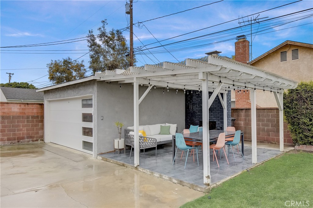 3743 North Studebaker Road Long Beach, CA 90808 - Photo 25 of 32 a view of a patio with table and chairs
