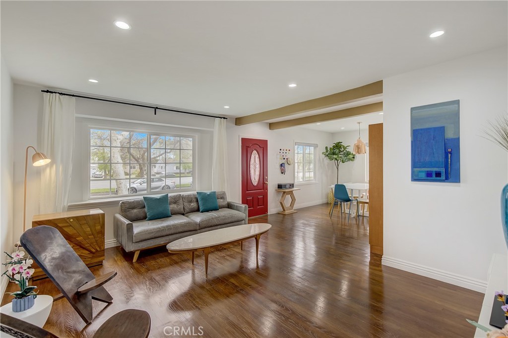 3743 North Studebaker Road Long Beach, CA 90808 - Photo 5 of 32 a living room with furniture and a wooden floor