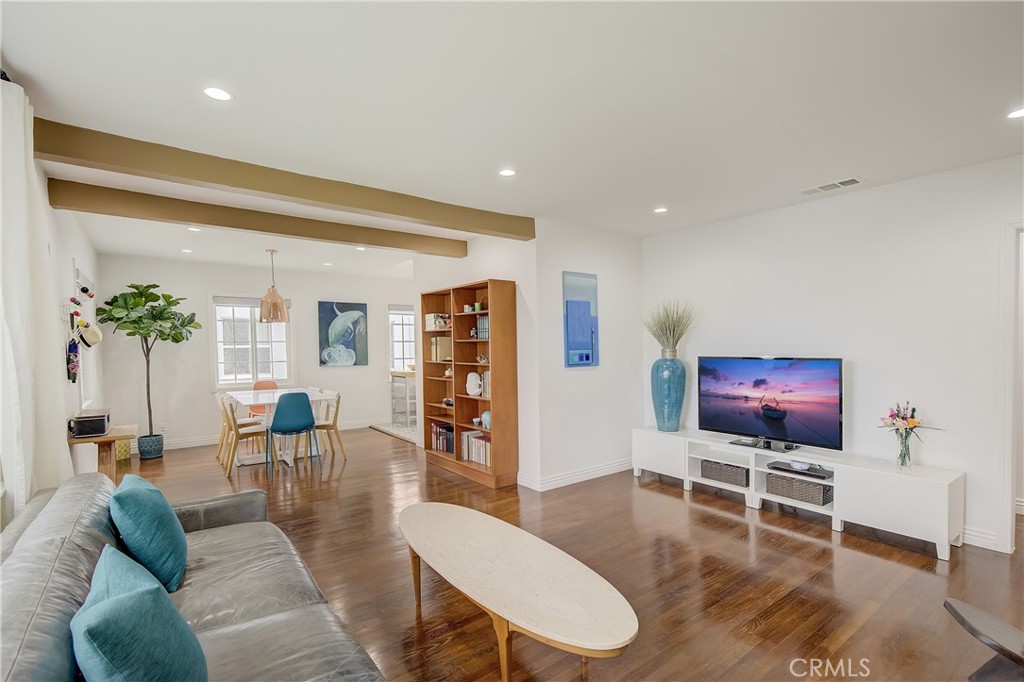 3743 North Studebaker Road Long Beach, CA 90808 - Photo 7 of 32 a living room with furniture and a flat screen tv