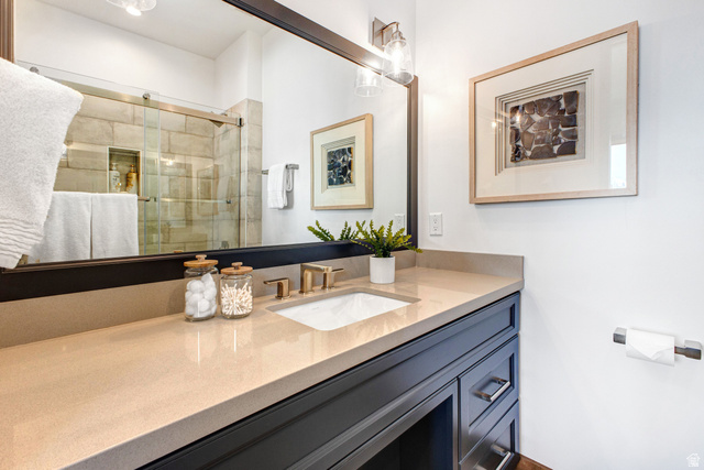 1282 Chimney Rock Road, Unit 344 Heber City, UT 84032 - Photo 42 of 55 Bathroom vanity with integrated sink and bronze-finish faucet