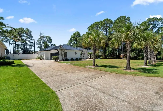 a view of a swimming pool with an outdoor seating
