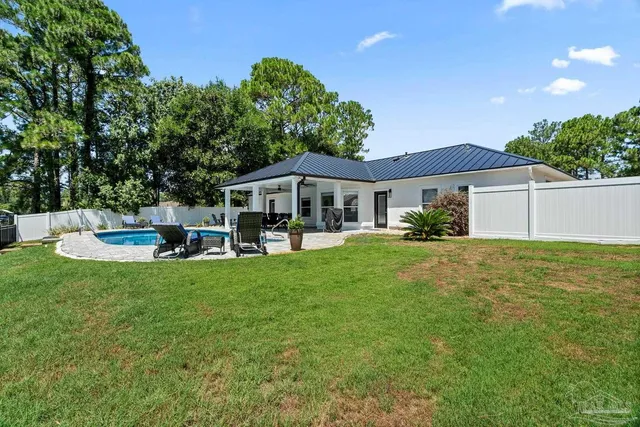 a view of a lake with boats and trees in the background