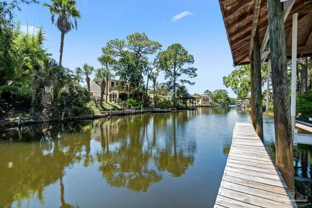 a kitchen with a stove a sink and a refrigerator