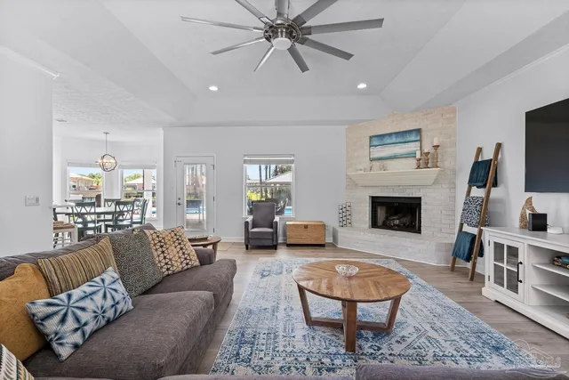 a large kitchen with stainless steel appliances and a sink