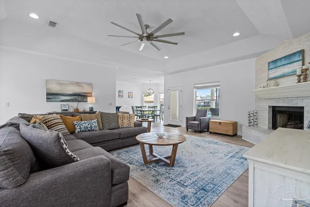 a kitchen with stainless steel appliances granite countertop a refrigerator and a stove