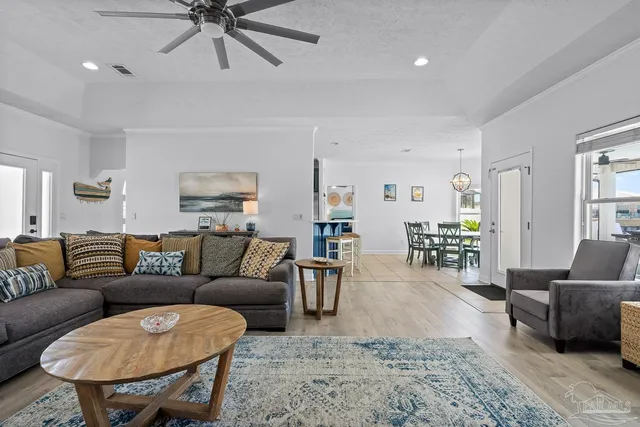 a kitchen with stainless steel appliances granite countertop a refrigerator and a microwave oven