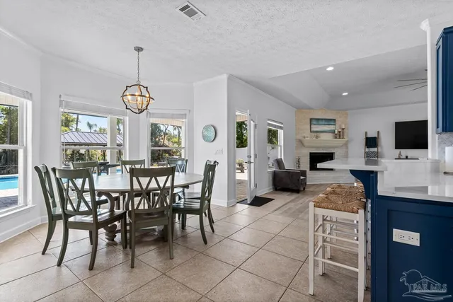 a view of backyard with outdoor seating and plants