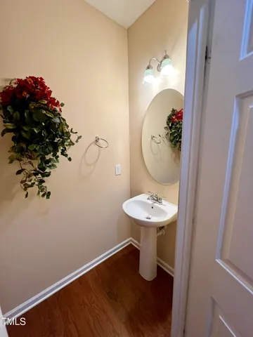 a view of yard with swimming pool and seating space