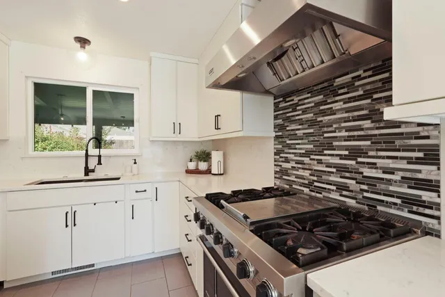 a living room with furniture ceiling fan and a rug