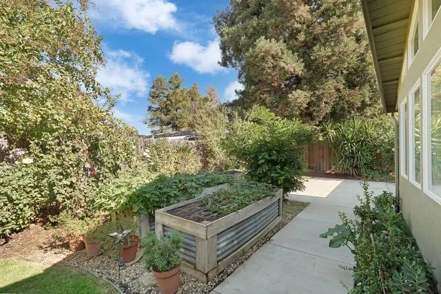 an aerial view of a house with a garden