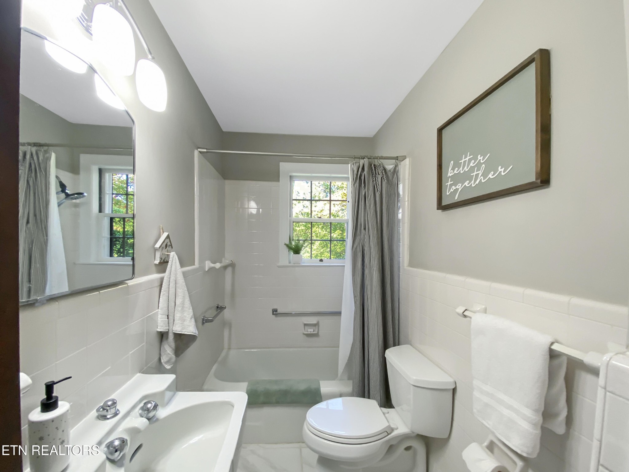 351 Country Club Road La Follette, TN 37766 - Photo 20 of 60 a white toilet sitting next to a bathroom sink and a shower