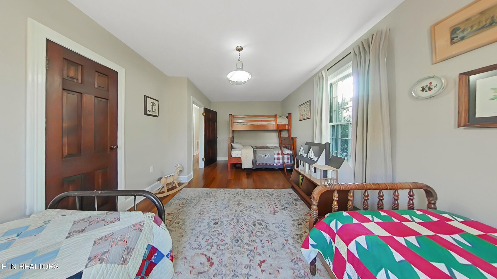 351 Country Club Road La Follette, TN 37766 - Photo 26 of 60 a bedroom with a bed and wooden floor