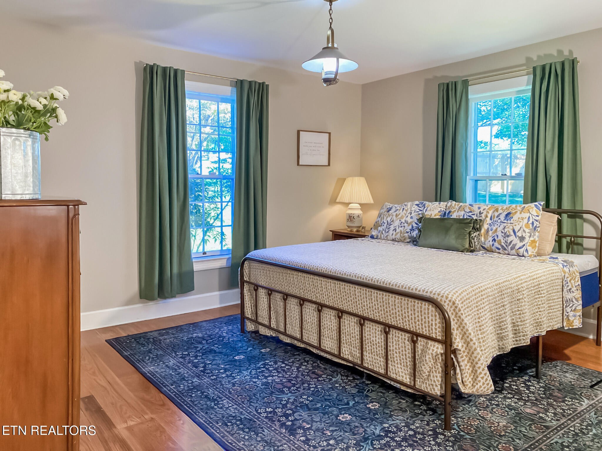 351 Country Club Road La Follette, TN 37766 - Photo 32 of 60 a bedroom with a large bed chandelier and windows