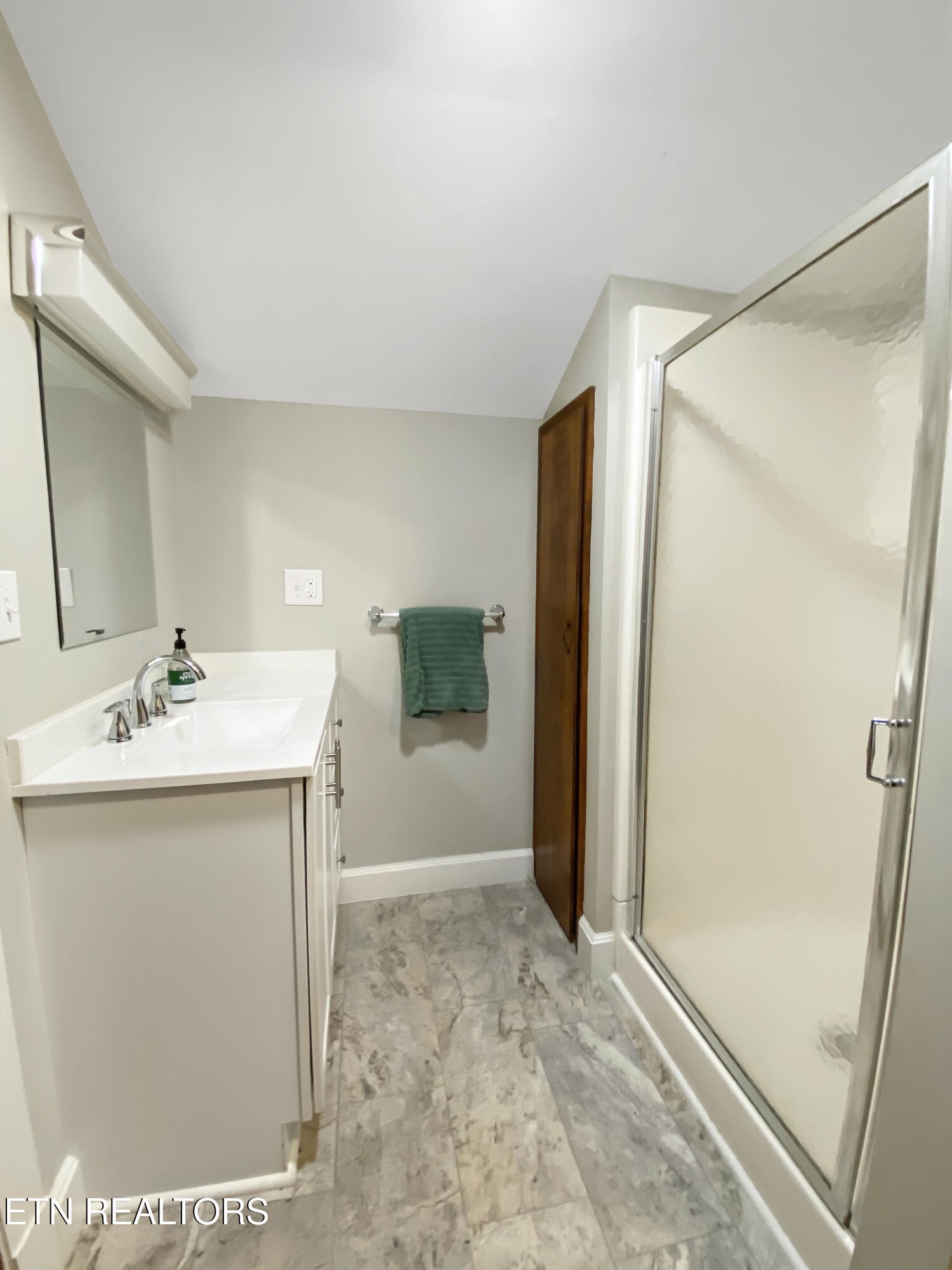 351 Country Club Road La Follette, TN 37766 - Photo 42 of 60 a bathroom with a sink and a mirror