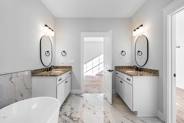 a view of bathroom with dual sinks