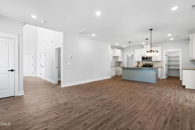 a view of kitchen with wooden floor and large window