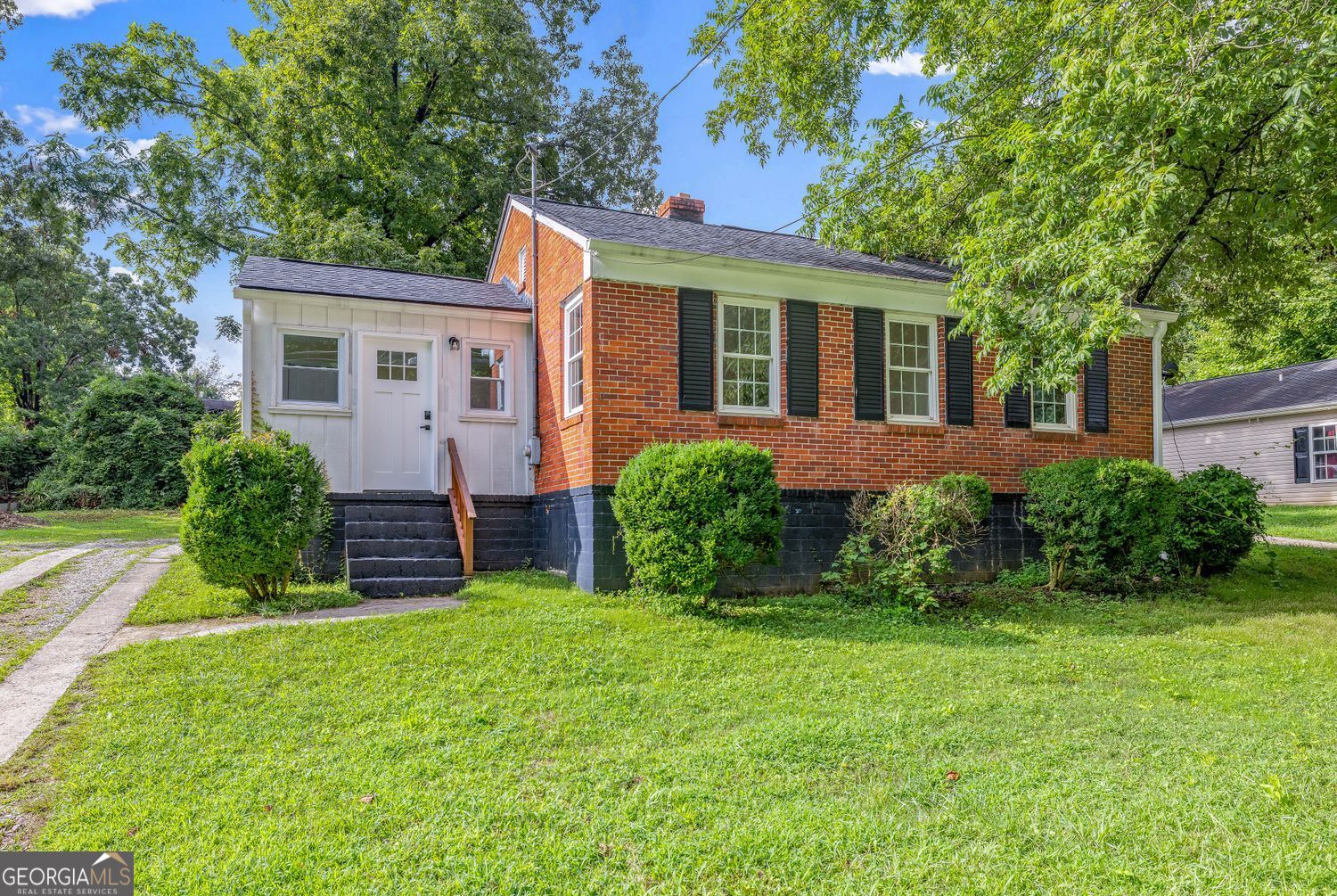 front view of a house and a yard