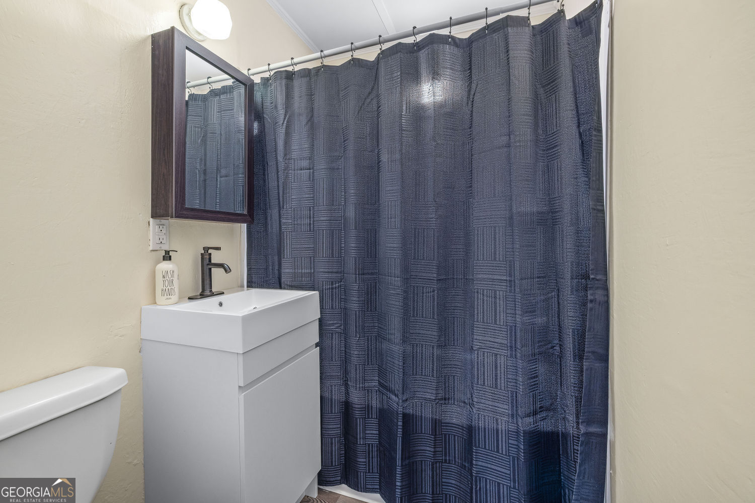 610 Level Grove Road Cornelia, GA 30531 - Photo 17 of 24 a view of bathroom with a sink and a toilet