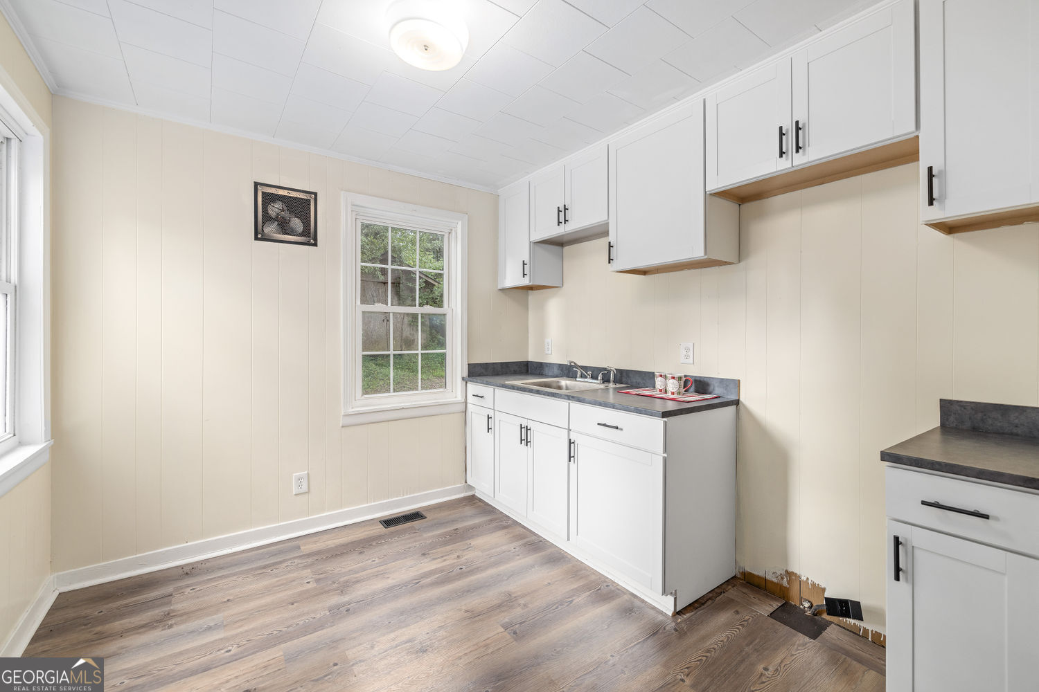 610 Level Grove Road Cornelia, GA 30531 - Photo 7 of 24 a kitchen with a stove top oven sink and cabinets