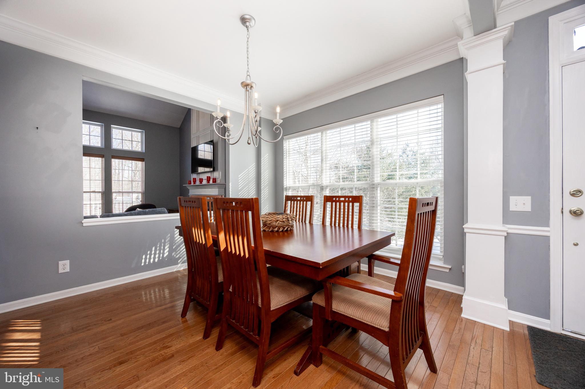 612 Churchill Road Chester Springs, PA 19425 - Photo 12 of 33 a view of a dining room with furniture window and wooden floor