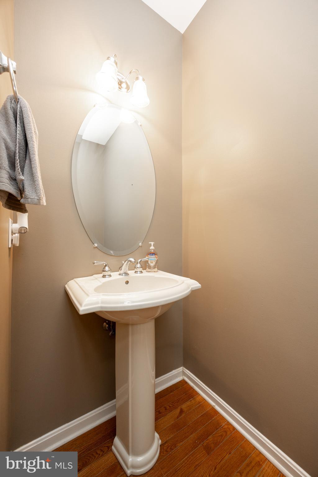 612 Churchill Road Chester Springs, PA 19425 - Photo 14 of 33 a bathroom with a sink a mirror and vanity