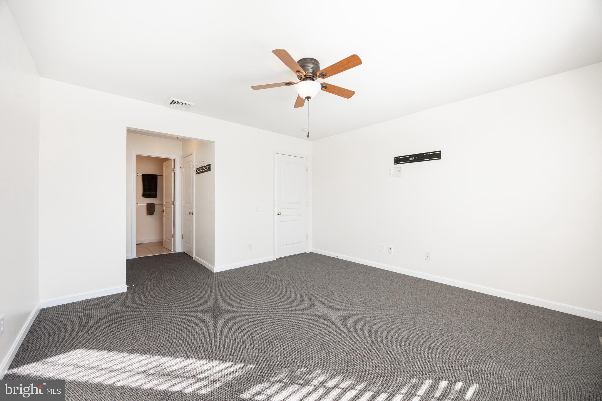 612 Churchill Road Chester Springs, PA 19425 - Photo 25 of 33 a view of a livingroom with a ceiling fan and window