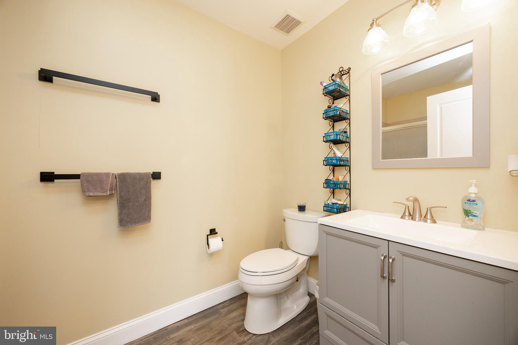 612 Churchill Road Chester Springs, PA 19425 - Photo 27 of 33 a bathroom with a sink a toilet and mirror